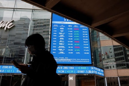 HK stocks slide but trading volume surges